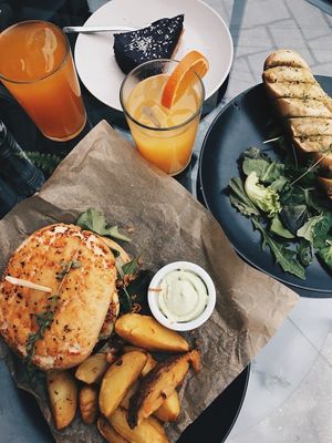Soy burger set, garlic bread, orange juice, apple juice, blackberry cake. 💚 this was in June 2020!  at Kozy Eats  in Riga