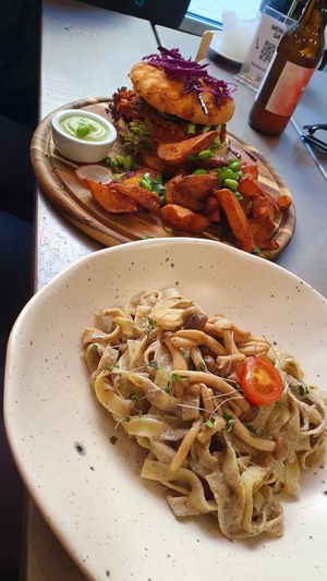Jackfruit burger and mushroom sauce pasta at Kozy Eats  in Riga
