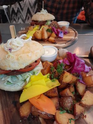 Soy burger in front, jackfruit behind at Kozy Eats  in Riga