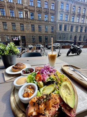 Breakfast plate + Avocado Bread and Cinnamon roll   at Kozy Eats  in Riga