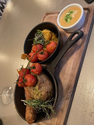 This is a baked potato with sausage - together with something like sauerkraut and a sauce. Really good! Also, the Chianti is very nice 🍷  at Kozy Eats  in Riga