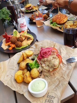 Topless burger & Hummus bowl at Kozy Eats  in Riga