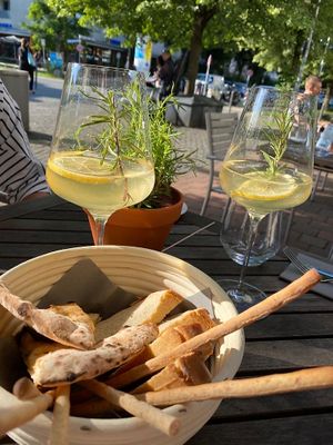 Bread basket and rosmary sprizz(vegan champaign ) at La Trattoria in Munich