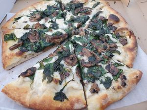 Spinach and mushroom pizza with white sauce at The King's Feet in Berkeley