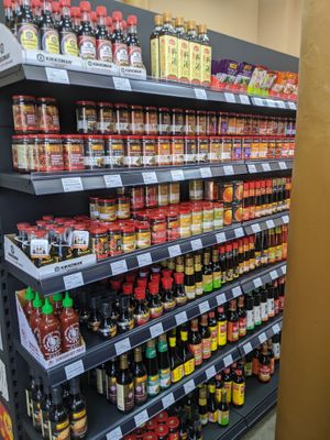 Selection of cooking sauces, soy sauces and cooking wine at Emacity in Glasgow