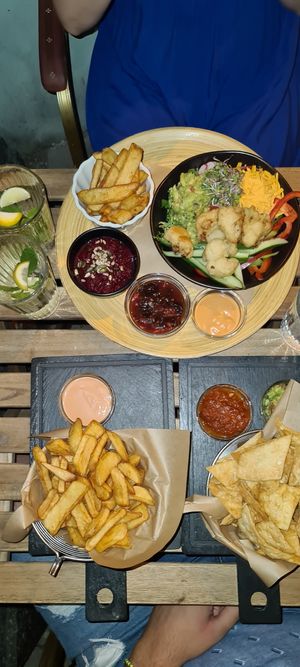 Fries, nachos, Buddha bowl with more fries at Pivstro in Plzen