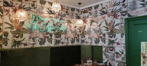 New cosy seats with neon deco at Maison Sukoon in Paris