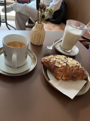 Flat white, chai latte and almond croissant.   at Cafe Harepus in Aarhus