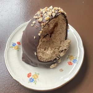 Flødeboller. Danish treat, with marshmallow filling - similar to a walnut whip or tea cake. This one was salted caramel & had a marzipan base.   at Cafe Harepus in Aarhus