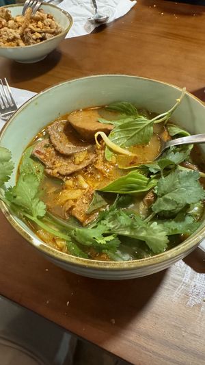 Royal spicy noodle bowl. Trumpet mushroom fritters in background.  at The Kind Bowl - Somerset in Central Singapore