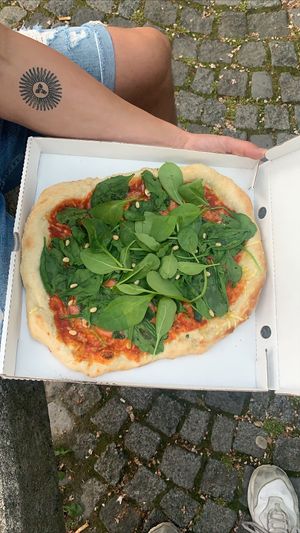 Spinach pizza at Mama Earth in Salzburg