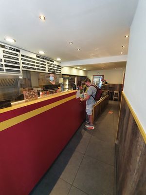 at the counter at Royal Frituur in Bruges