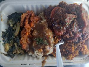 Full heavy plate! Greens, yams, mashed, pumpkin stuffing & jerk jackfruit at Vegan Hood Chefs in San Francisco