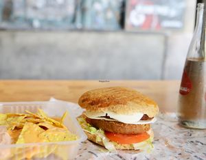 Double vegan burger with vegan cheese at Gopal - Vegan Deli in Barcelona