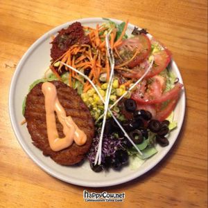 bunless burger with salad at Gopal - Vegan Deli in Barcelona
