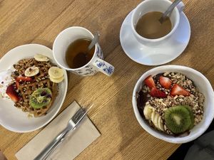 Breakfast with waffles, acai bowl, tea, milk coffee (plantbased milk)  at Zer0 in Manacor
