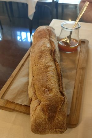 Traditional artisan wheat germ bread and tomato solmnjero. at La Tizna - Casa de Comidas Sostenible in Sevilla