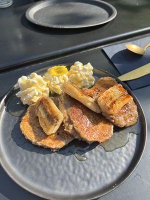 Vegan pancakes, baked banana, and vegan caramel  at Lilith Coffee in Rotterdam