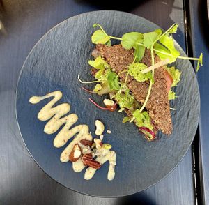 bread with pea hummus and vegan bacon  at Lilith Coffee in Rotterdam