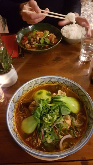 Soup with dumplings and soy pieces, lemongrass curry at Ong Tao Vegan in Frankfurt