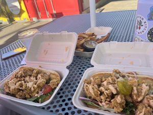 Two oyster mushroom po’ boys and cheese fries  at Vegan Crave in Kansas City