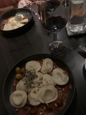 Vegan Ravioli filled with almond mozzarella in arrabbiata sauce  at Grappa in Dorado