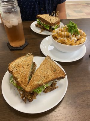 House burger, rose fizzy, and soooo yummy loaded fries! The cheese was fantastic! at Sprout Vegan Cafe in Kihei