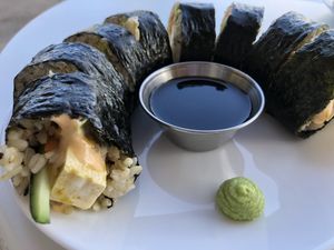 The Spicy Tofu Roll-brown rice, carrot, cucumber, avocado, marinated raw tofu, house siracha aioli. 🌱😋 at Sprout Vegan Cafe in Kihei