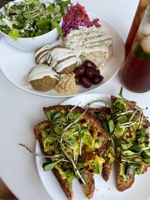 Yummy Mediterranean plate & Avo Toast. Very scrumptious and filling for two. Will try this place again.  at Sprout Vegan Cafe in Kihei