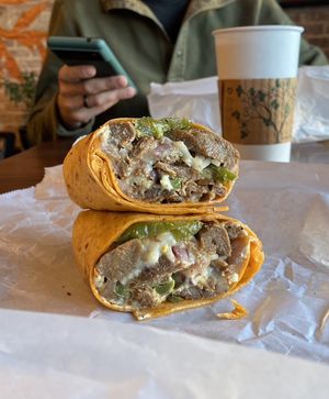 Vegan Philly cheesesteak on sun dried tomato wrap 🌯   at Yorgo's Bageldashery in Norfolk
