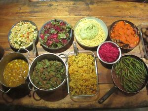 Vegan buffet: Quinoa Salad, Beet Salad, Pumpkin Curry, Lentil Stew, Avocado Pesto, Red Kraut, Patatas Bravas, Green Beans in Tomato Sauce, & Zucchini Balls at Secret Garden in Mompiche