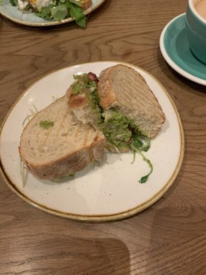 Vegan bread with pea smash, walnuts, pomegranates and tahini dressing  at Birdie & Co - Bagelstraße in Dusseldorf