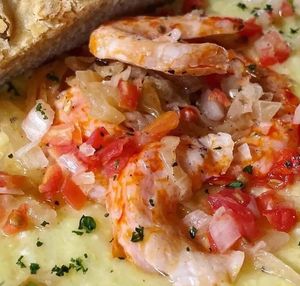 Shr!mp & Grits (Gluten Free, Soy Free) Available during Weekend Brunch at Early Bird Vegan locations. at Trash Panda Vegan in Phoenix