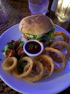 Delicious black bean burger and onion rings  at Indómitos Café & Bar in Uvita