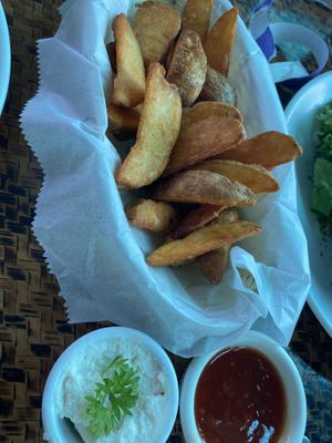Potato wedges with vegan garlic dip  at Indómitos Café & Bar in Uvita