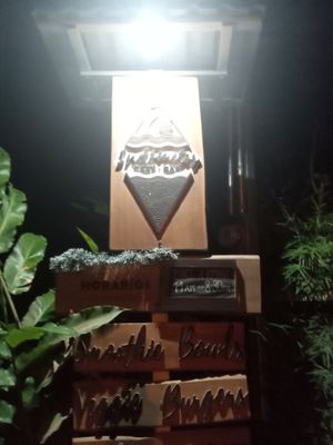 The sign by the road/entrance. at Indómitos Café & Bar in Uvita