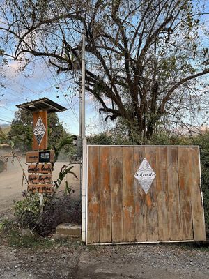 Gate & Road Sign at Indómitos Café & Bar in Uvita