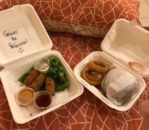 Takeaway food - mushroom croquettes and beyond burger with onion rings  at Indómitos Café & Bar in Uvita