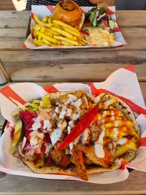 Burger, Fries coleslaw and salad. at Hank's Vegan Restaurant in Ipswich