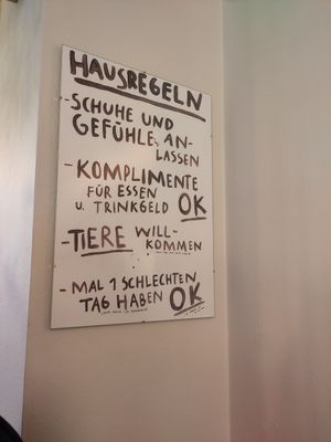 Funny house rules #Veganuary at OM NOM NOM CAFÉ in Munich