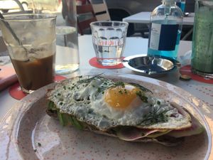 Vegan Fredo cappuccino and really tasty sourdough toast with egg, watermelon radish, avocado slices and tomato at Joshua Tree Cafe in Athens