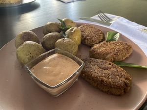 Baked potatoes and soy meat patties  at Veget Vegan in Kharkiv