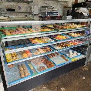 All the BLUE trays are vegan 😲😲😲 amazing selection of vegan donuts!! at Big Baby Rolls and Donuts in Tulsa