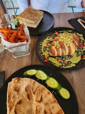 White chocolate croissant, sweet potato fries, spinach quesadilla, omelet sandwich at Elysian Restaurant in Nicosia