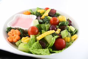 Seasonal Salad - Lettuce, tomatoes, cucumber, corn, pine nuts, and seasonal fruit with raspberry dressing at White Springs Cafe in Arcadia