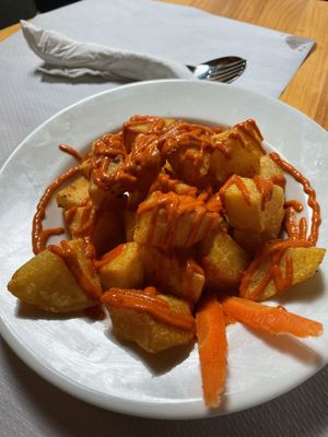 Patatas bravas with tomato sauce  at Veggie Garden in Sitges