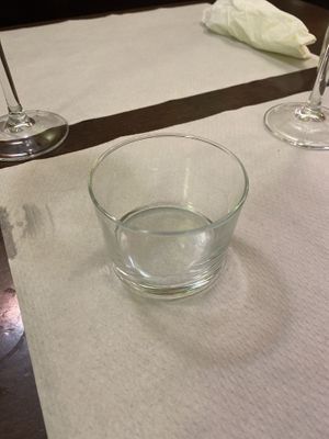 A very small glass of tap water  at Veggie Garden in Sitges