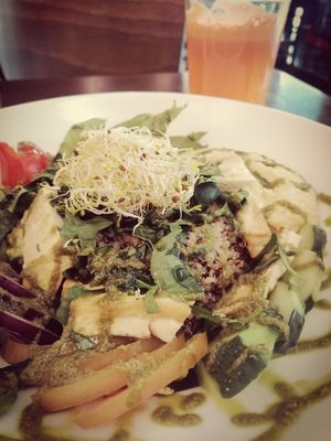 Protein Buddha Bowl with fresh carrot juice at Veggie Garden in Sitges