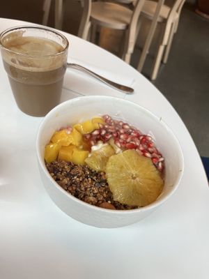 Granola bowl and latte with almond milkk  at Roots - Maschinenstraße in Zurich