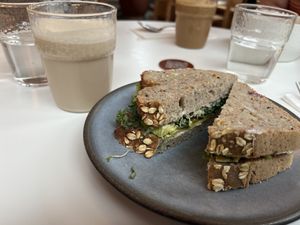Avocado sandwich and chai latte with almond milkk  at Roots - Maschinenstraße in Zurich